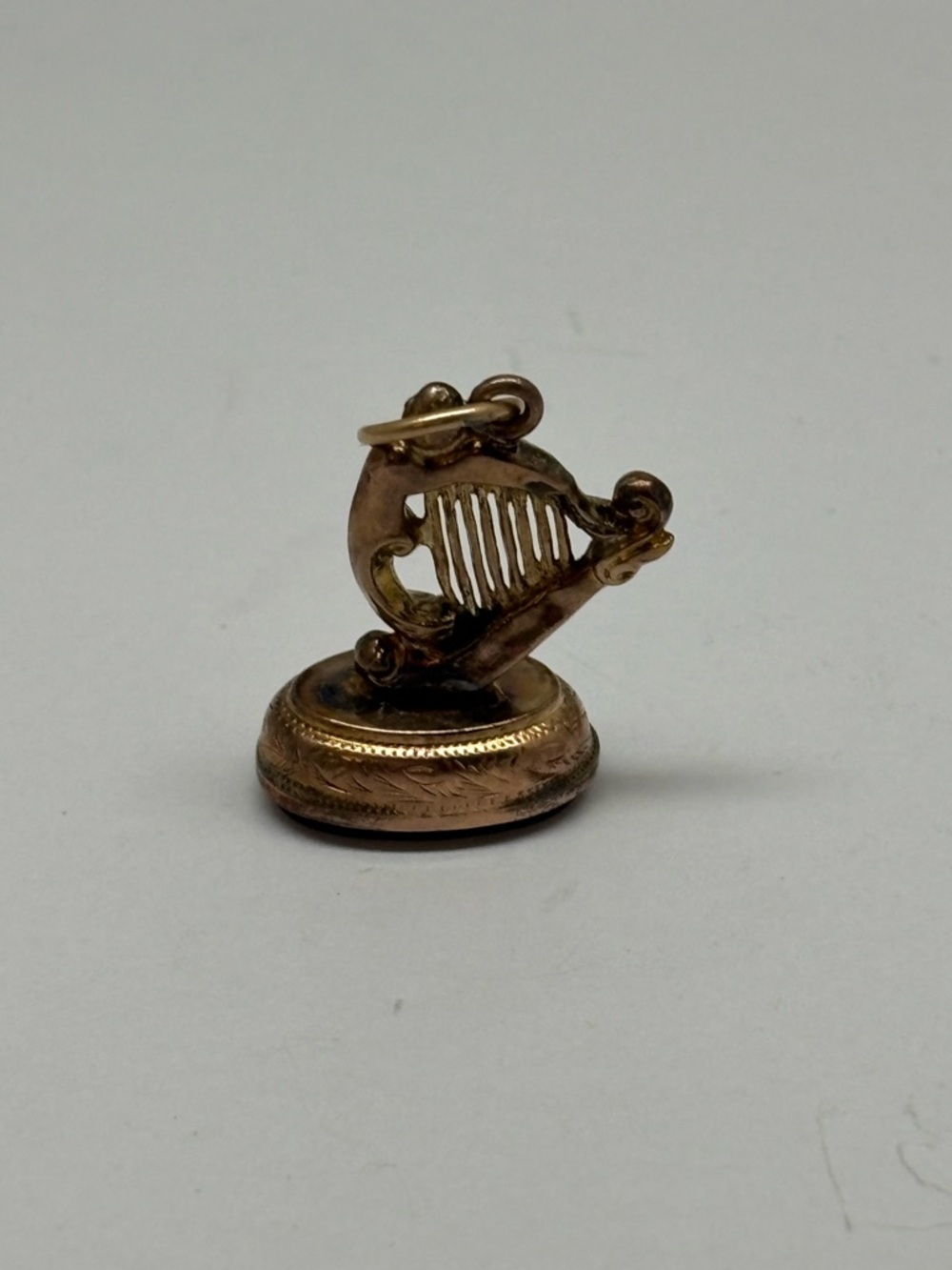 Vintage 9ct Harp Charm with Dark Brown/red Stone